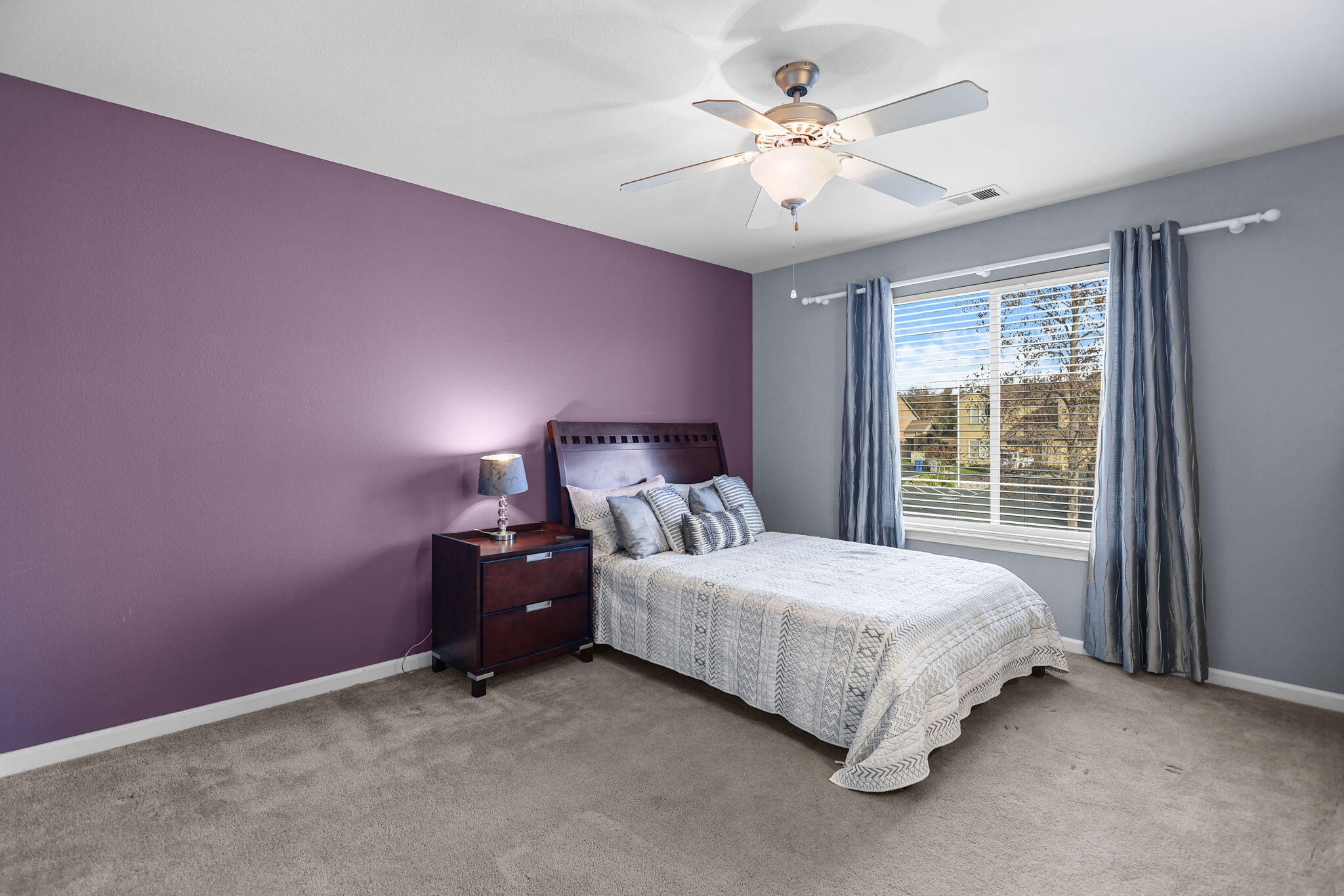 3156 Niklaus Path Redding, CA 96002 - Photo 18 of 34 a bedroom with a bed and a ceiling fan