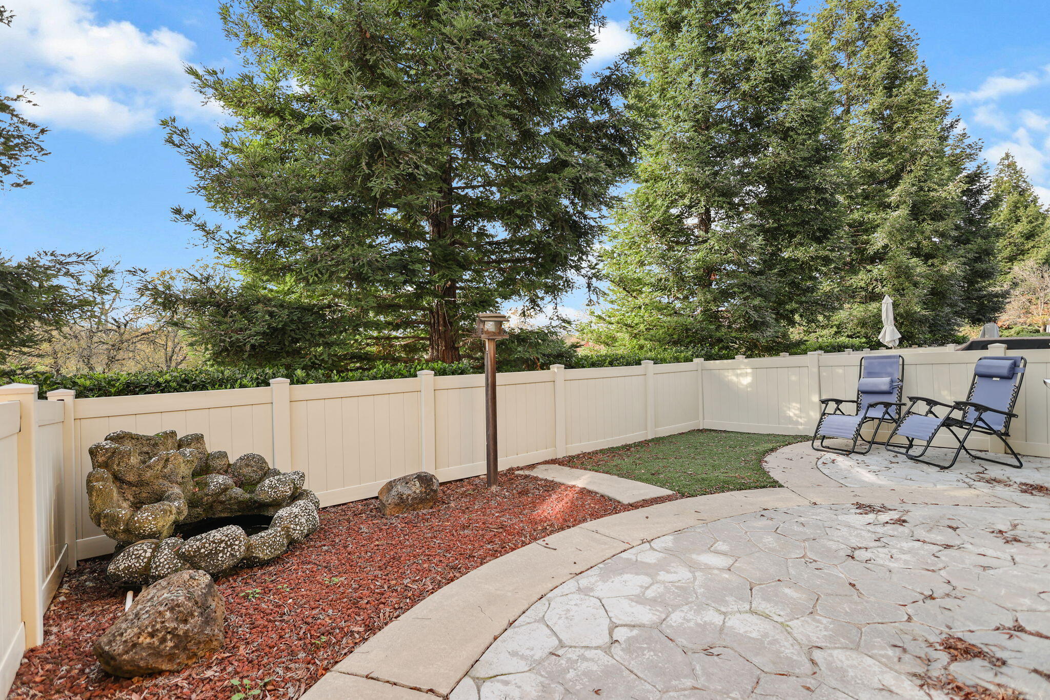 3156 Niklaus Path Redding, CA 96002 - Photo 23 of 34 a view of backyard with a table and chairs