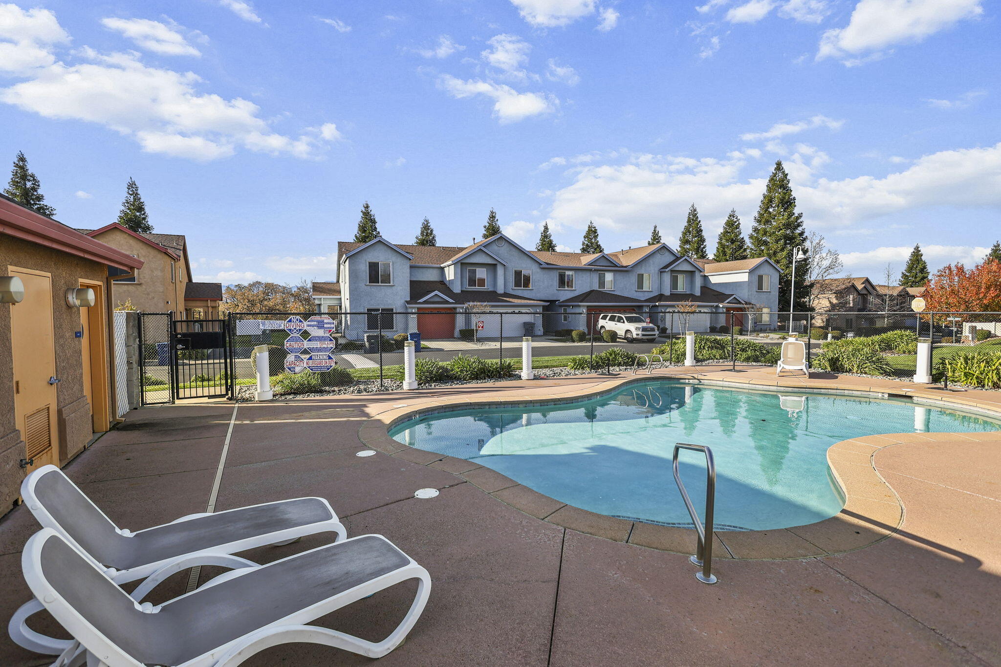 3156 Niklaus Path Redding, CA 96002 - Photo 28 of 34 a view of a swimming pool and a terrace