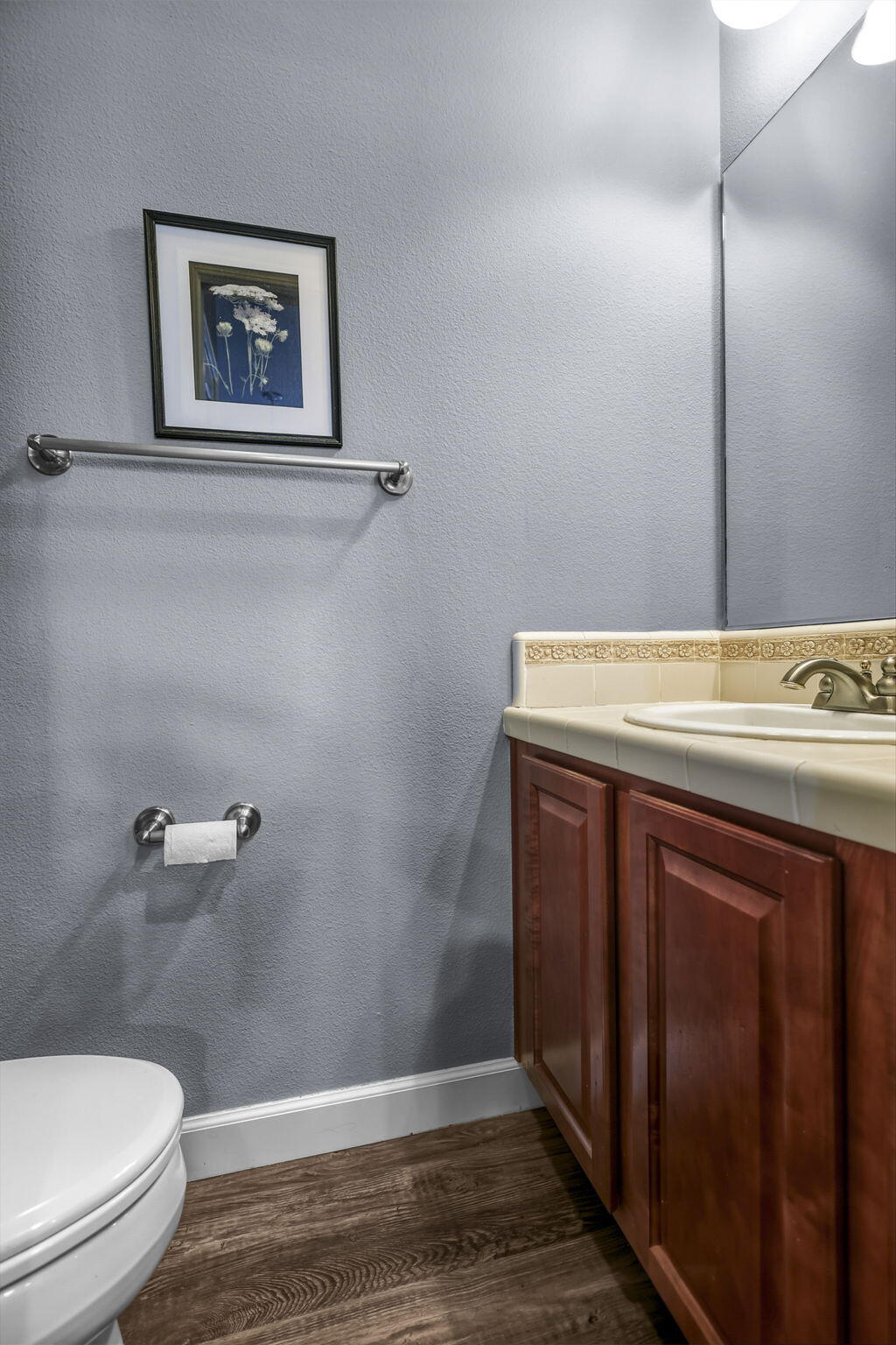 3156 Niklaus Path Redding, CA 96002 - Photo 9 of 34 a bathroom with a sink a toilet and a mirror