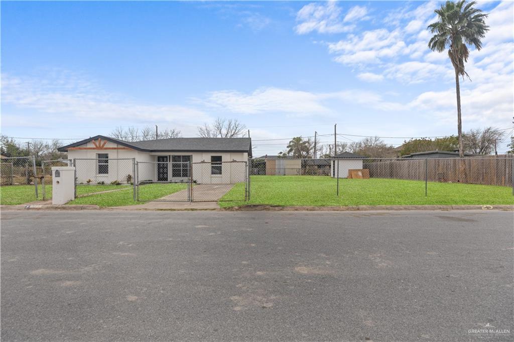 313 West Eller Avenue Pharr, TX 78577 - Photo 2 of 15 a view of a house with a big yard and large trees