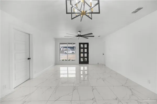 a view of an empty room with a window