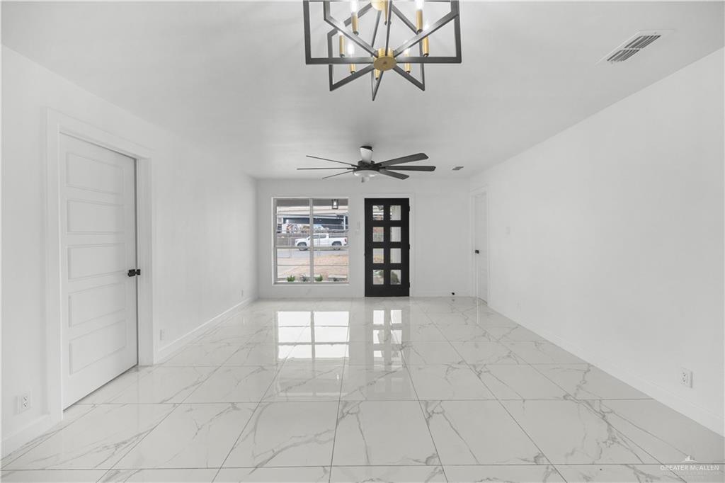 313 West Eller Avenue Pharr, TX 78577 - Photo 4 of 15 a view of an empty room with a window