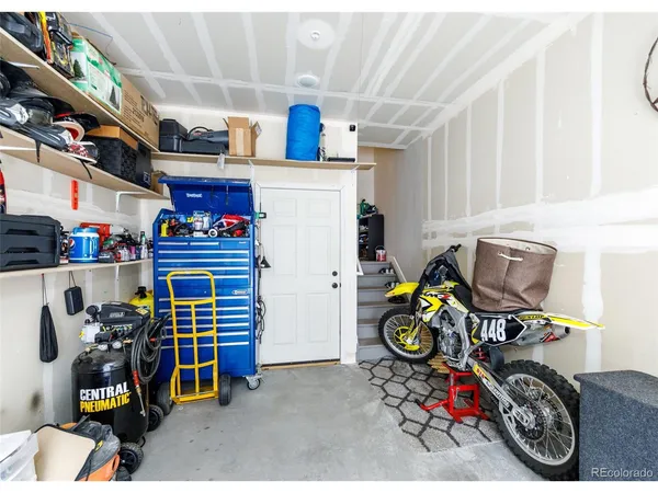 a kitchen with a stove and a white cabinet