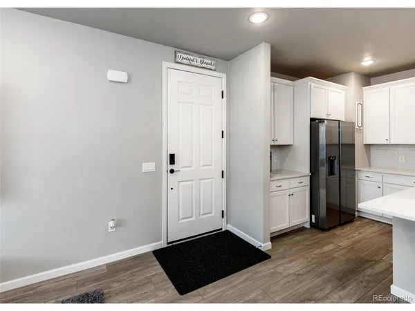 a kitchen with stainless steel appliances a refrigerator and cabinets