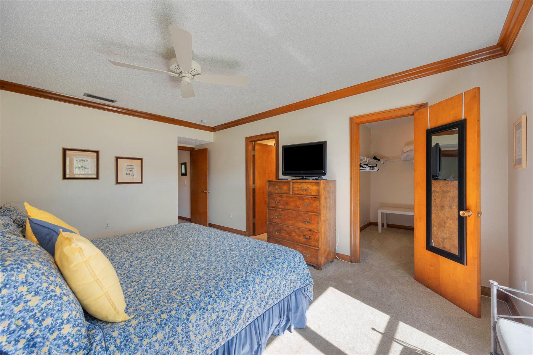 13244 Polo Club Road, Unit C207 Wellington, FL 33414 - Photo 17 of 31 a bedroom with a bed and a flat screen tv