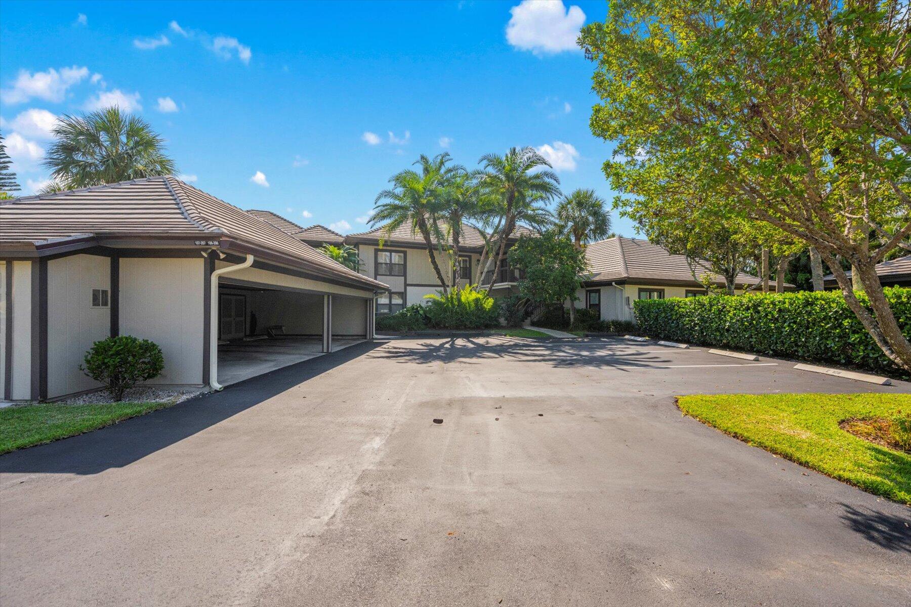 13244 Polo Club Road, Unit C207 Wellington, FL 33414 - Photo 22 of 31 a house view with a swimming pool