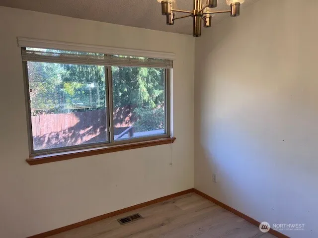 a view of a room that has a large window