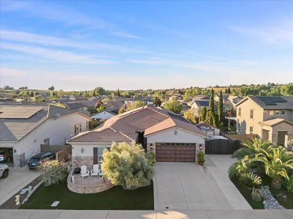a aerial view of a house with a yard