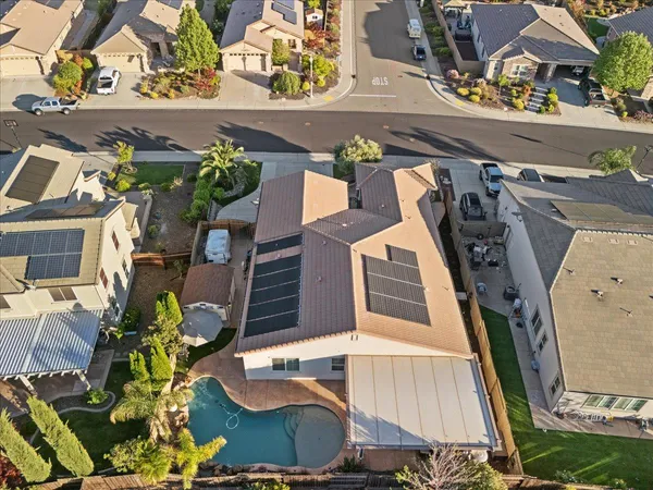 an aerial view of a house with a ocean view
