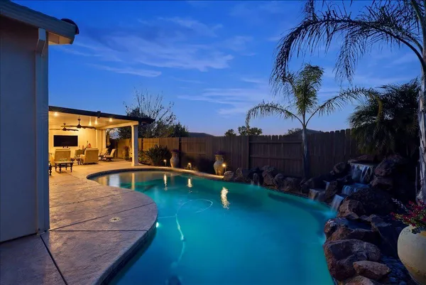 a view of a swimming pool with a patio
