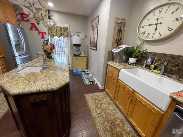 a utility room with sink dryer and washer