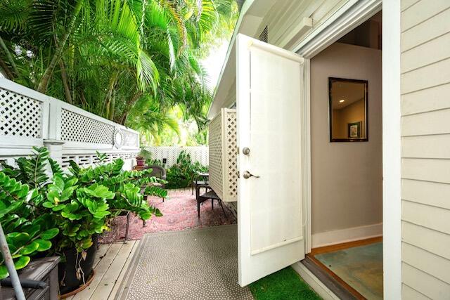 1218 Packer Street, Unit REAR Key West, FL 33040 - Photo 19 of 22 a view of a path along with potted plants