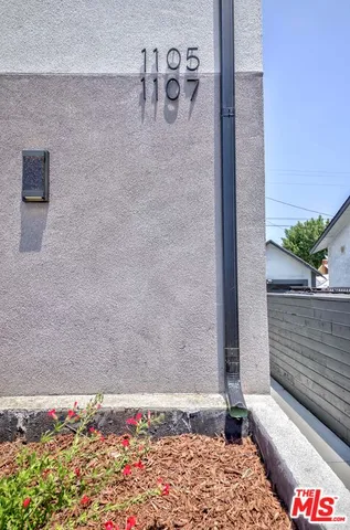 a kitchen with stainless steel appliances kitchen island granite countertop a sink and cabinets