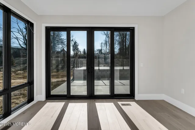 a view of front door with wooden floor