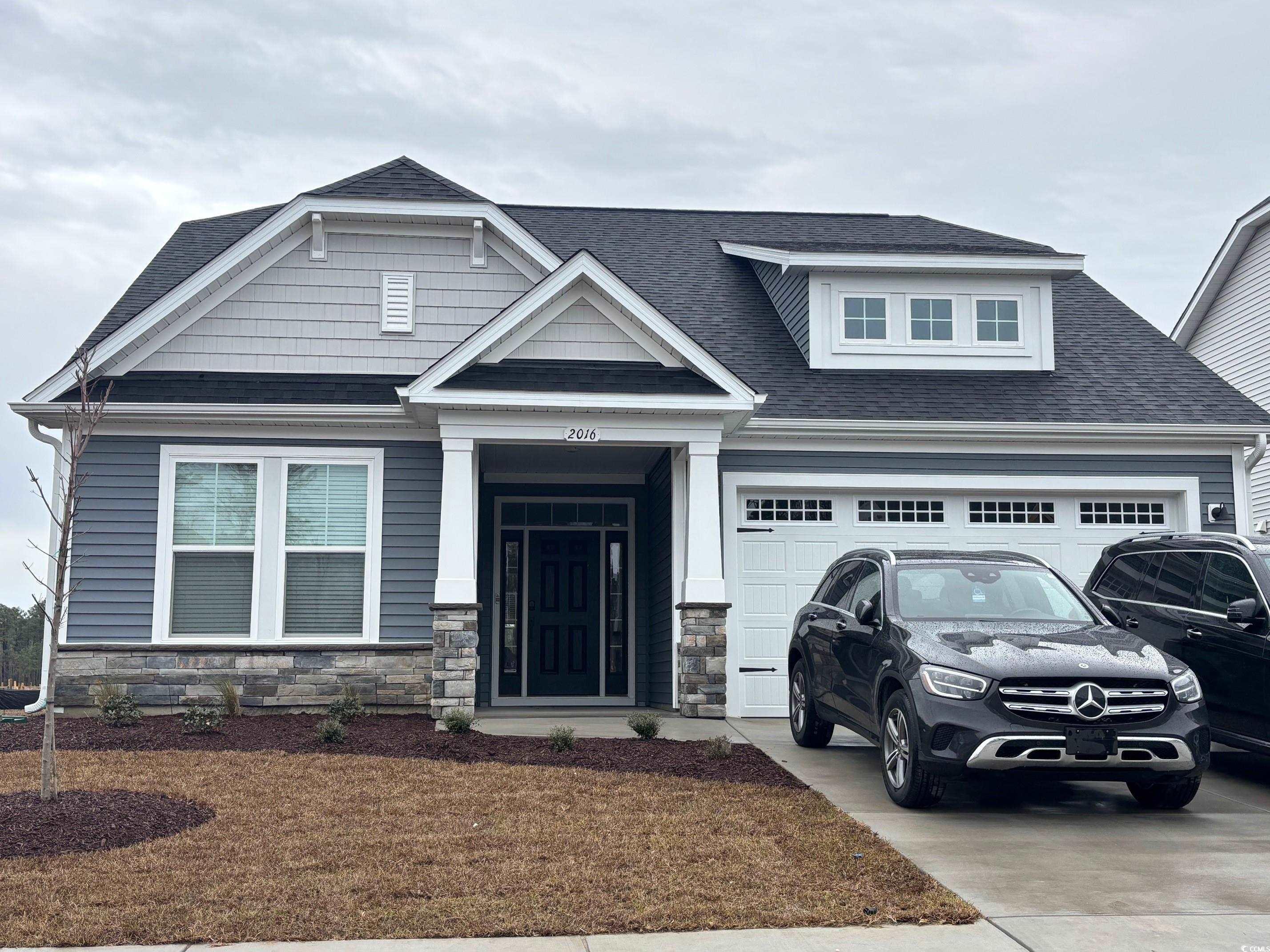 2016 Woodrush Loop Little River, SC 29566 - Photo 1 of 1 Craftsman house featuring a garage