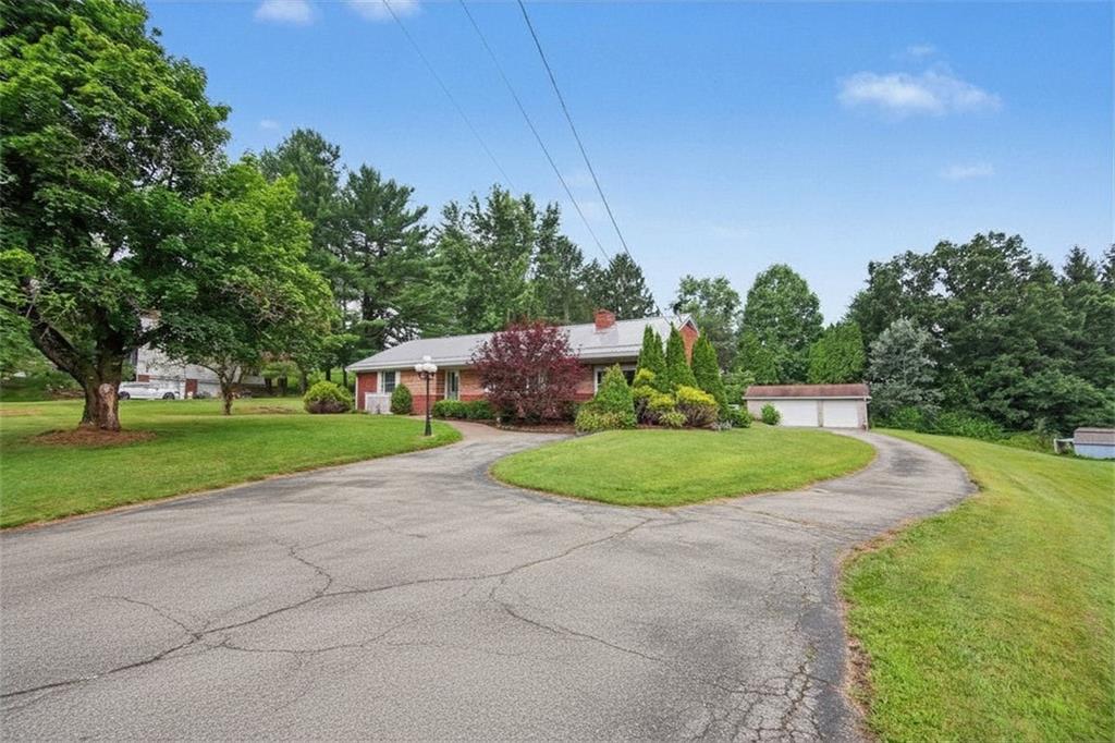 330 Butler Road Saxonburg, PA 16056 - Photo 2 of 28 a view of a house with a big yard plants and large trees