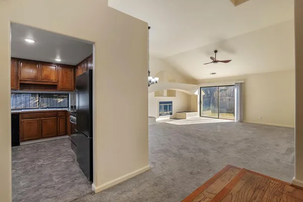 a open kitchen with kitchen island a sink stainless steel appliances and cabinets