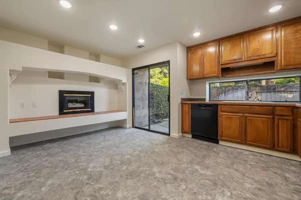 a view of a kitchen with a sink cabinets and a window