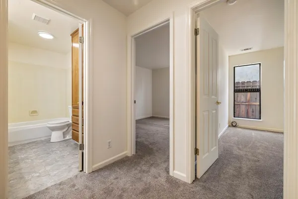 a view of a bathroom with a tub and shower