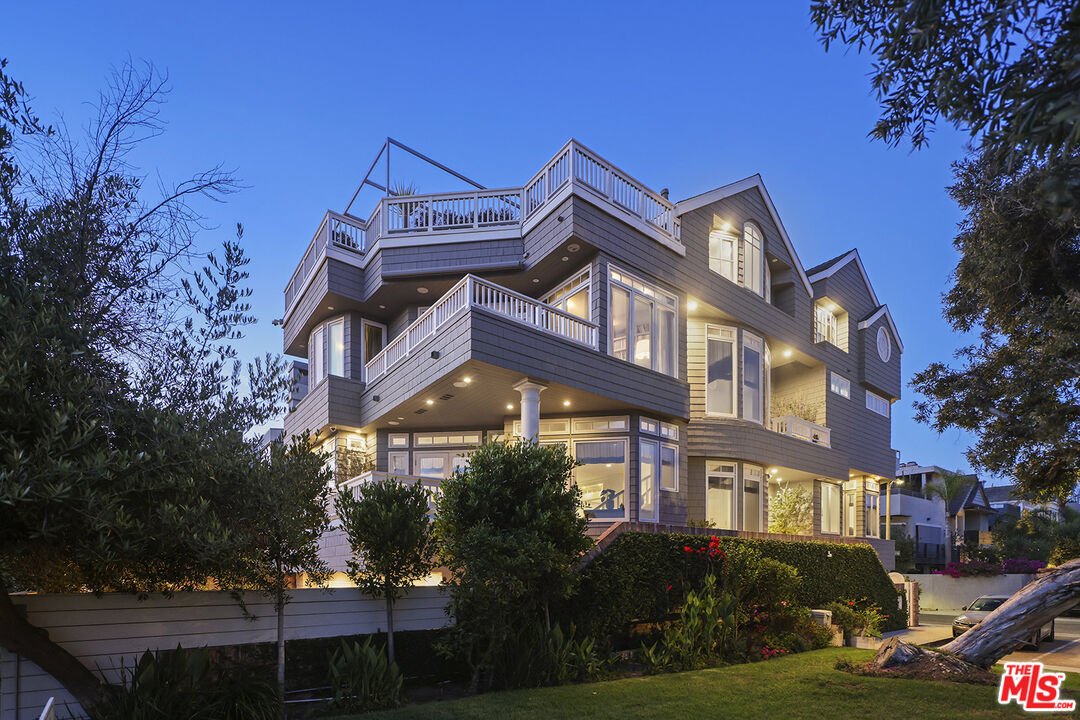 4619 Roma Court Marina del Rey, CA 90292 - Photo 5 of 5 a front view of a residential apartment building with a yard