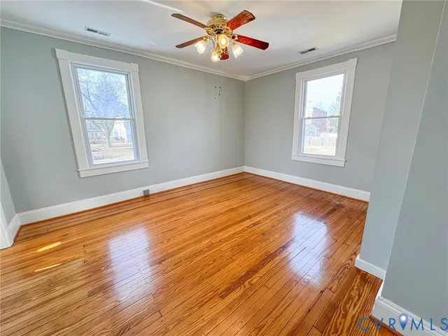 a bathroom with a toilet a sink and a mirror