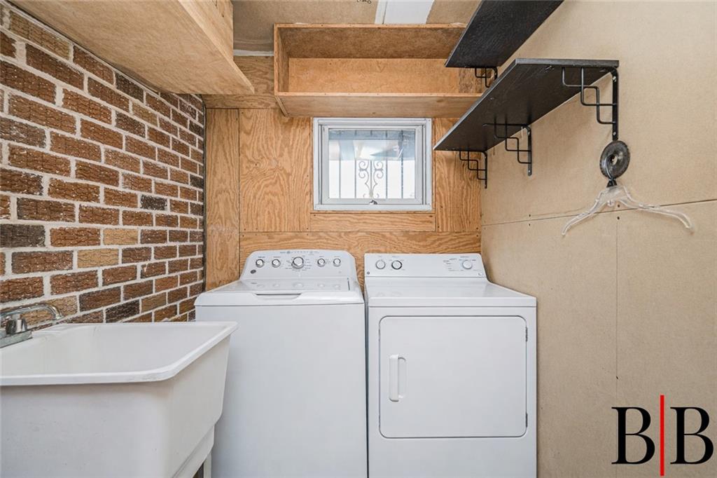2042 Ralph Avenue Brooklyn, NY 11234 - Photo 21 of 24 a utility room with dryer and washer