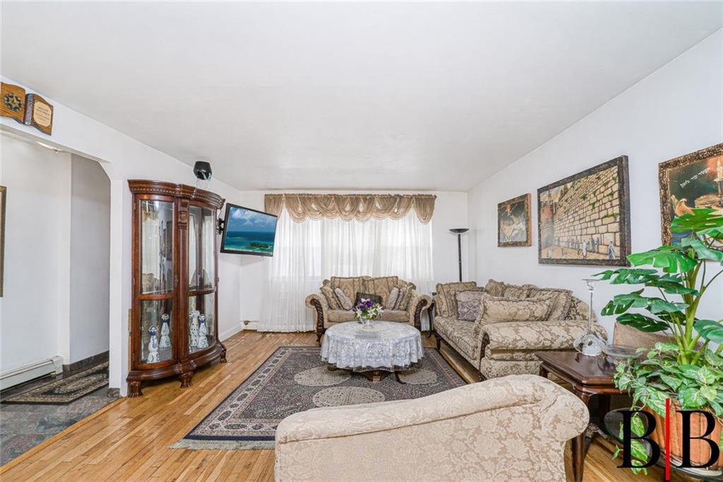 2042 Ralph Avenue Brooklyn, NY 11234 - Photo 8 of 24 a living room with furniture and a window