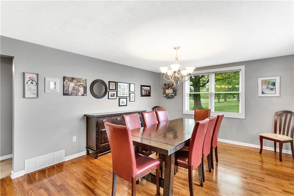 149 Fredericktown Road Midland, PA 15059 - Photo 6 of 50 a view of a dining room with furniture window and wooden floor