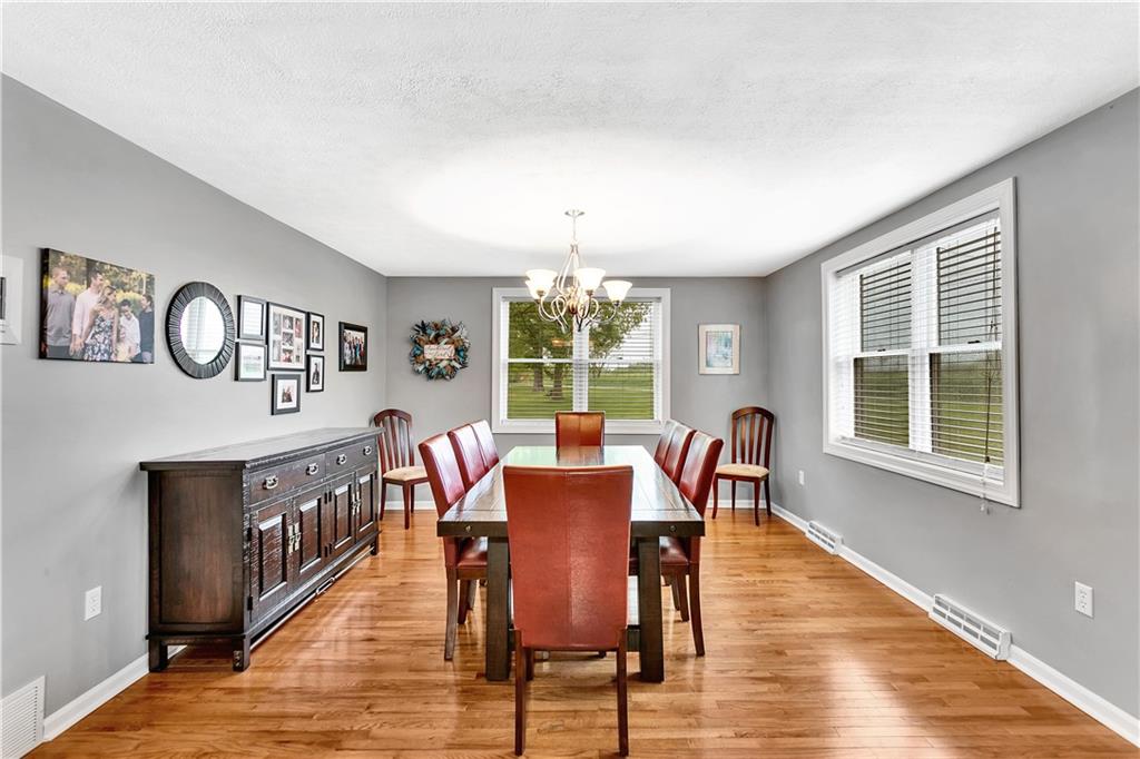 149 Fredericktown Road Midland, PA 15059 - Photo 7 of 50 a view of a dining room with furniture window and wooden floor