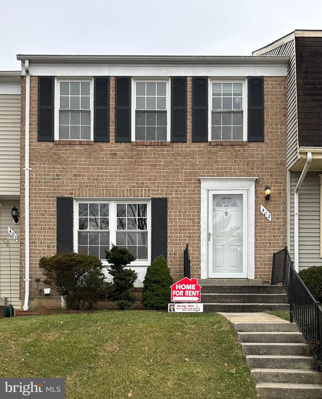 402 Carousel Court Gaithersburg, MD 20877 - Photo 1 of 29 a front view of a house with a yard