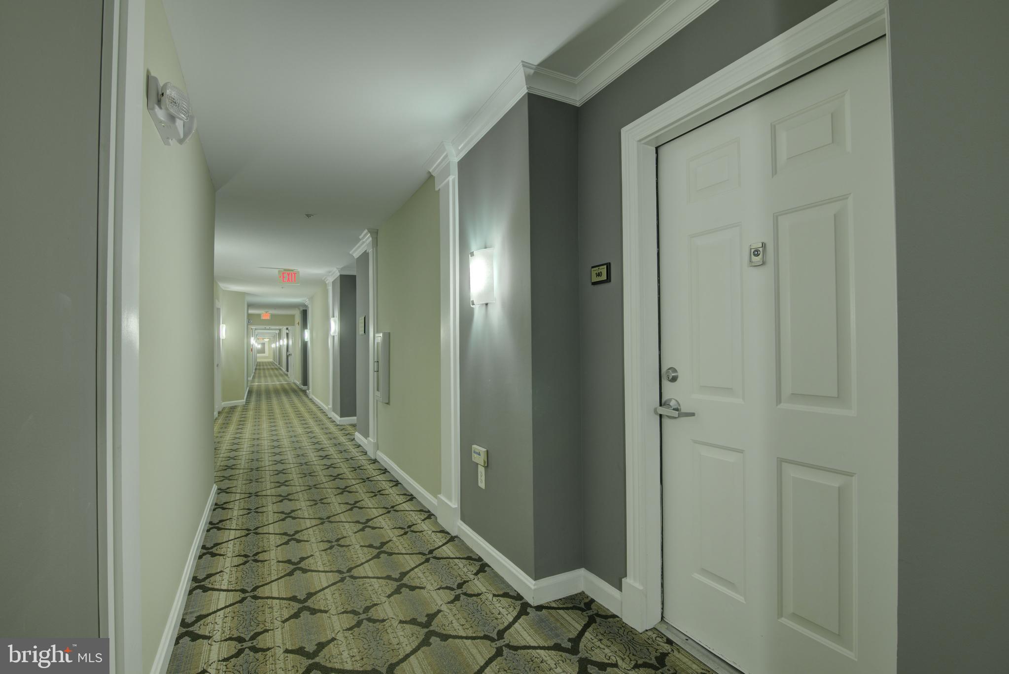 12000 Market Street, Unit 140 Reston, VA 20190 - Photo 17 of 30 Condo front door and hallway