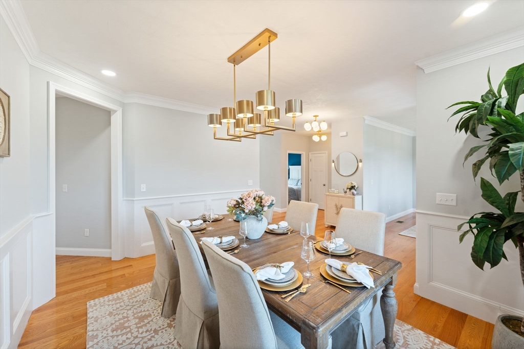 11 Chadwick Road Hudson, MA 01749 - Photo 12 of 39 a view of a dining room with furniture a chandelier and wooden floor