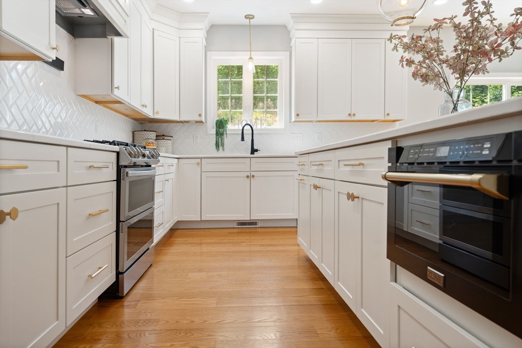 11 Chadwick Road Hudson, MA 01749 - Photo 17 of 39 a kitchen with cabinets appliances and a window