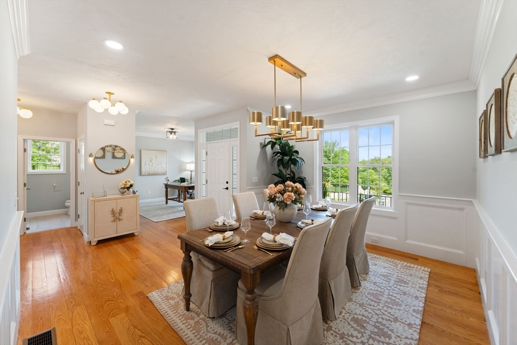 11 Chadwick Road Hudson, MA 01749 - Photo 20 of 39 a view of a dining room with furniture a chandelier and wooden floor