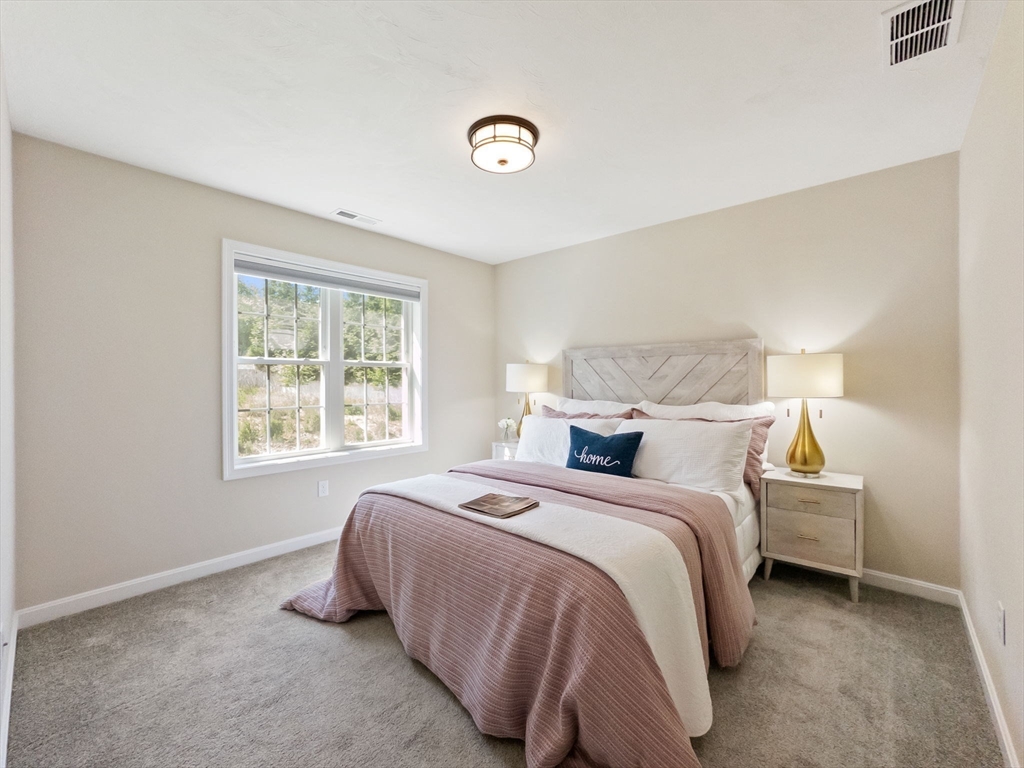 11 Chadwick Road Hudson, MA 01749 - Photo 32 of 39 a bedroom with a bed and a window