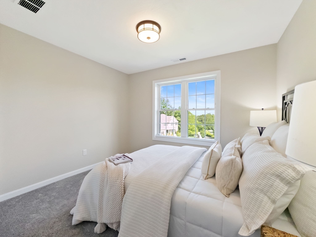11 Chadwick Road Hudson, MA 01749 - Photo 34 of 39 a bedroom with a bed and a window