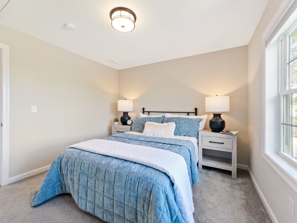 11 Chadwick Road Hudson, MA 01749 - Photo 35 of 39 a bedroom with a bed and a large window