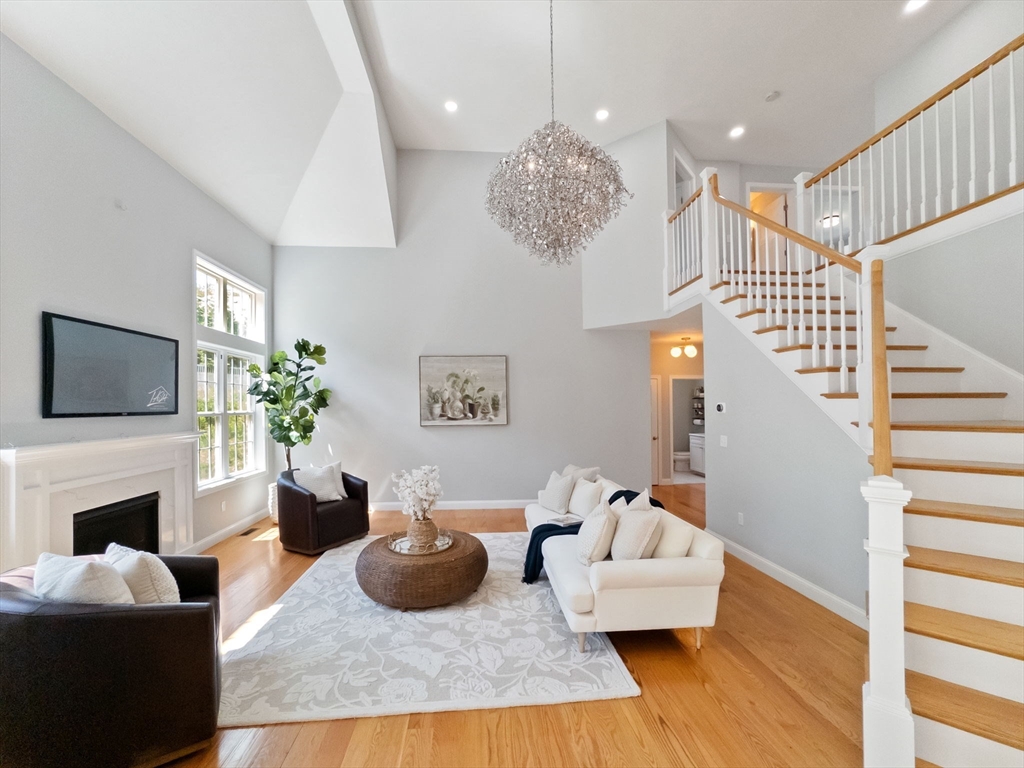 11 Chadwick Road Hudson, MA 01749 - Photo 9 of 39 a living room with furniture fireplace and flat screen tv
