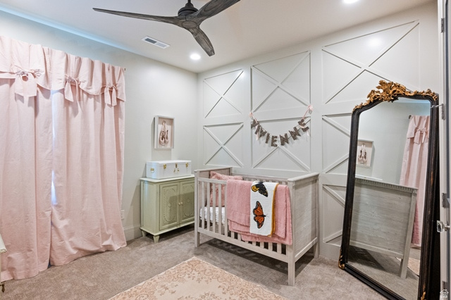 3 Carriagewood Cove, Unit 1088 Sandy, UT 84092 - Photo 42 of 79 Recessed ceiling lighting illuminates the room, featuring a modern ceiling fan and decorative wainscoting on the far wall