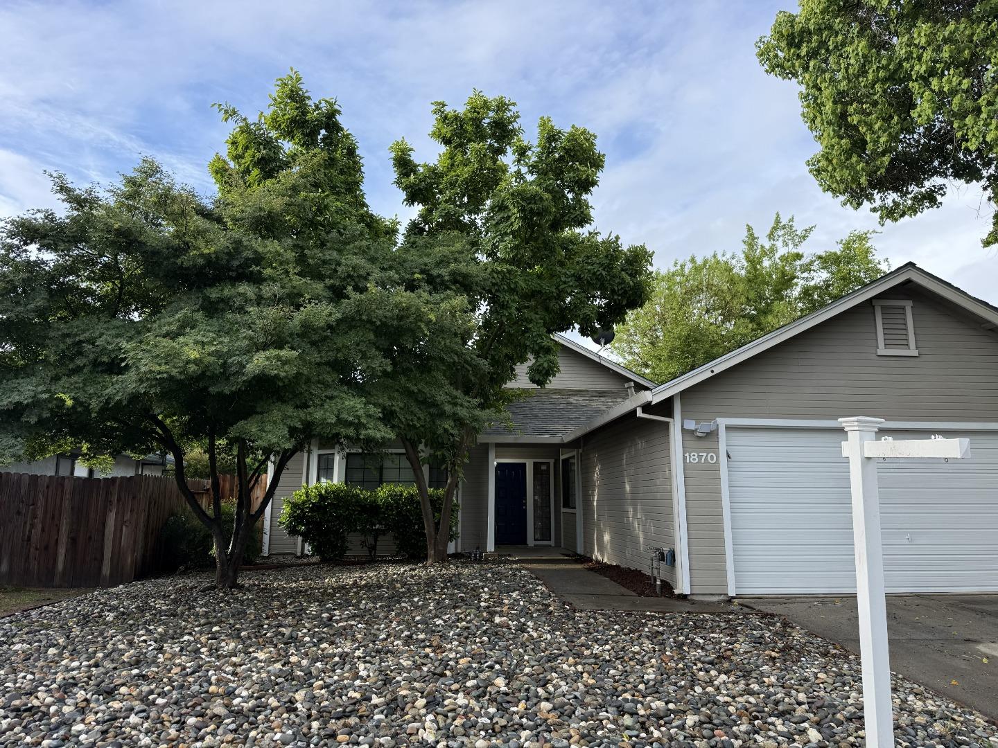 1870 Azurite Way Sacramento, CA 95833 - Photo 1 of 38 a front view of a house with garden