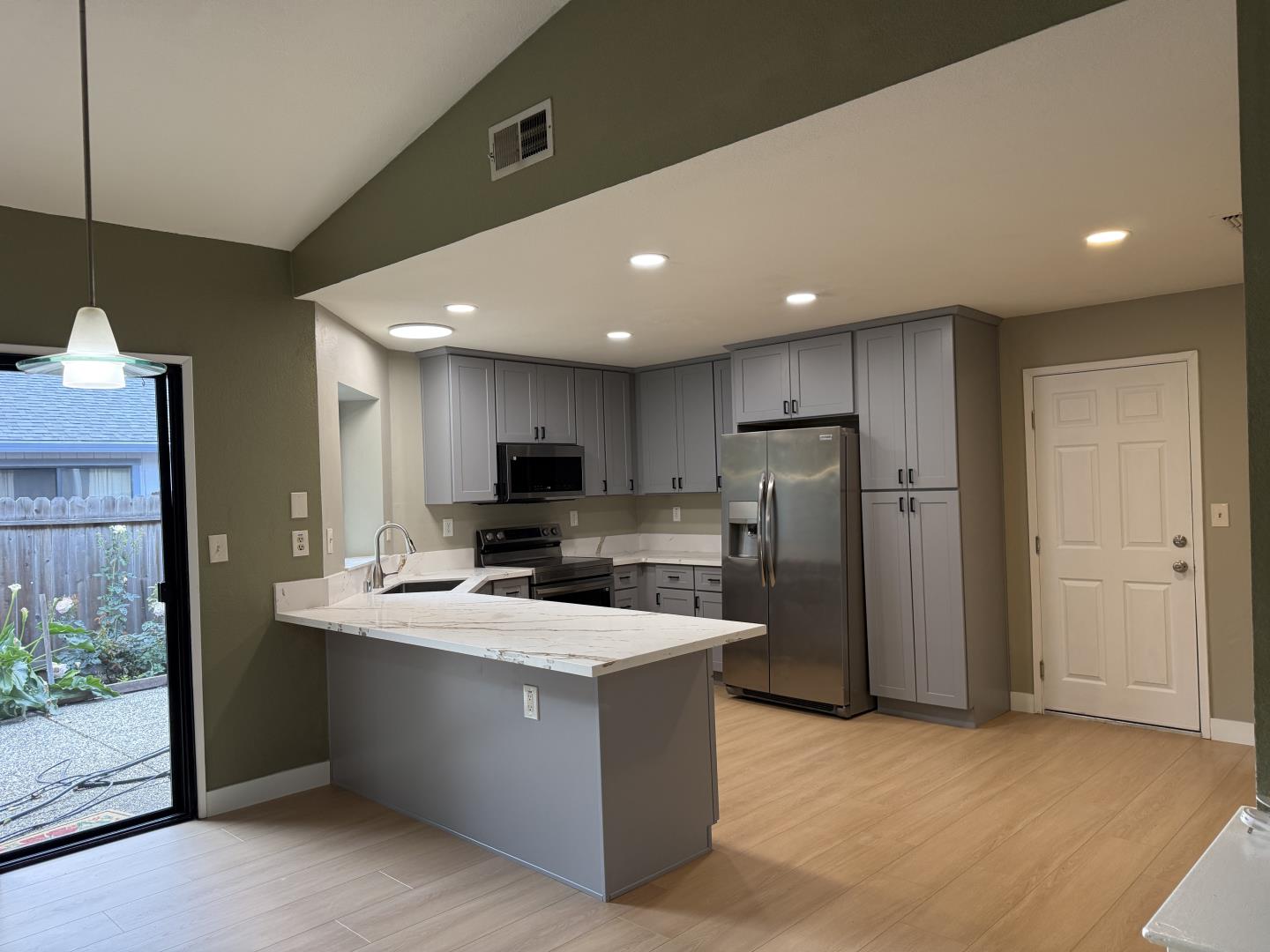 1870 Azurite Way Sacramento, CA 95833 - Photo 14 of 38 a large kitchen with a large counter top appliances and cabinets
