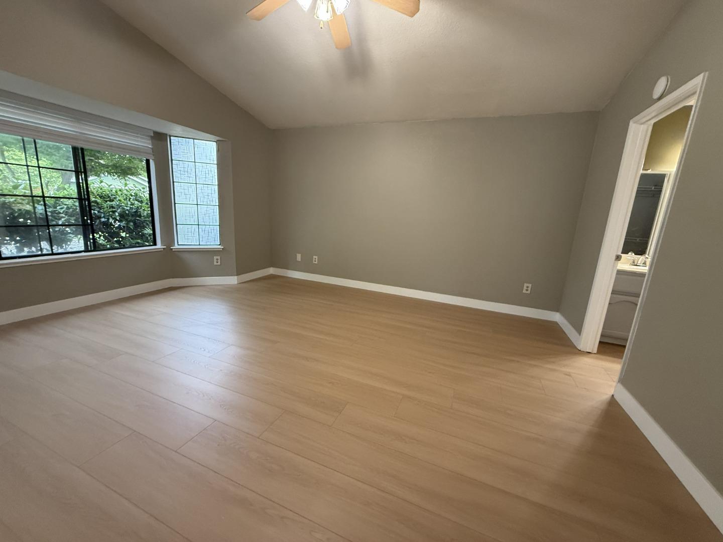 1870 Azurite Way Sacramento, CA 95833 - Photo 17 of 38 an empty room with wooden floor and windows