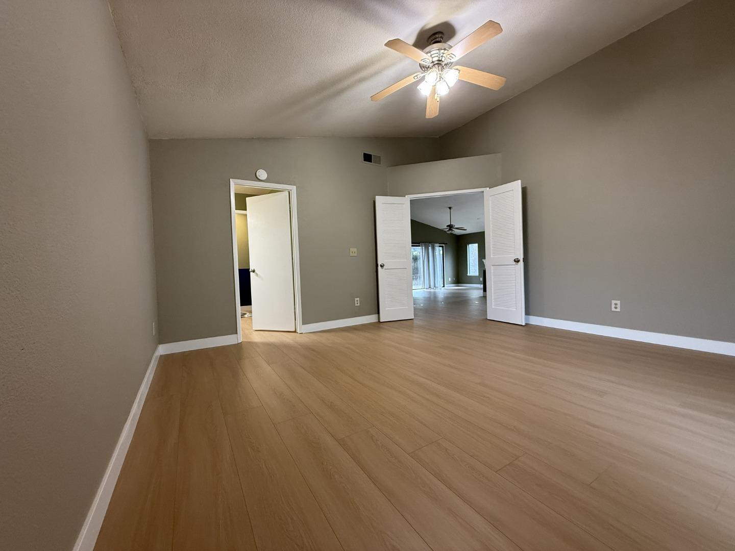 1870 Azurite Way Sacramento, CA 95833 - Photo 21 of 38 a view of an empty room with a chandelier fan