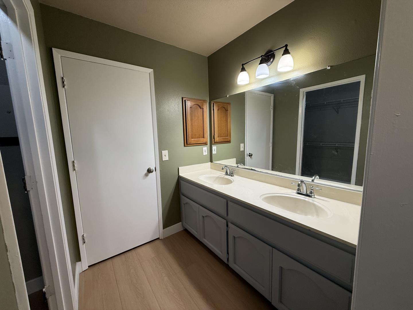 1870 Azurite Way Sacramento, CA 95833 - Photo 24 of 38 a bathroom with a double vanity sink and a mirror