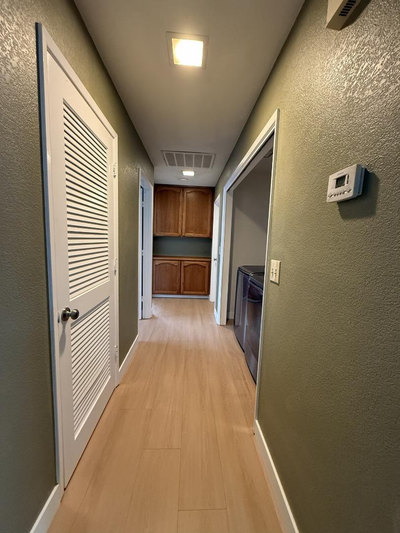 1870 Azurite Way Sacramento, CA 95833 - Photo 27 of 38 a view of a hallway with wooden floor and staircase