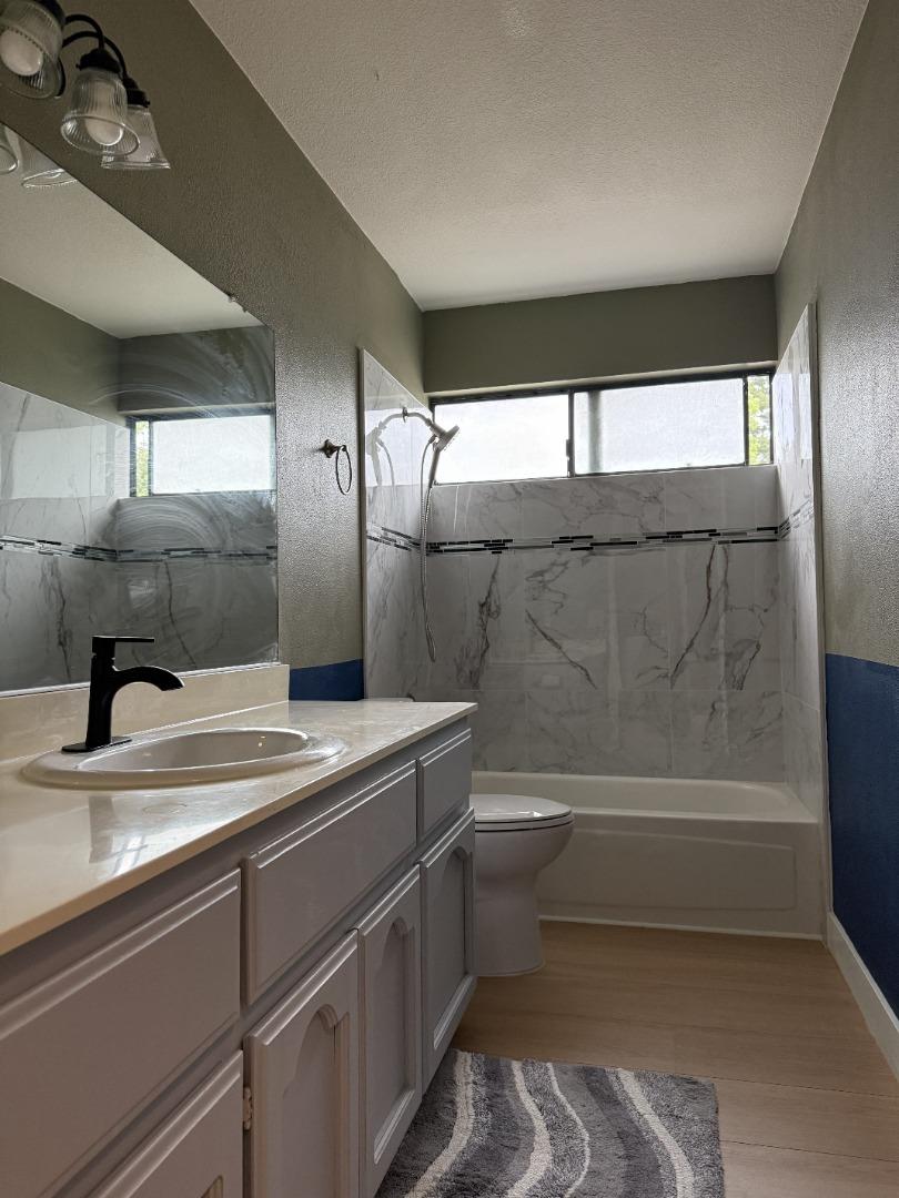 1870 Azurite Way Sacramento, CA 95833 - Photo 28 of 38 a bathroom with a sink a toilet and bathtub