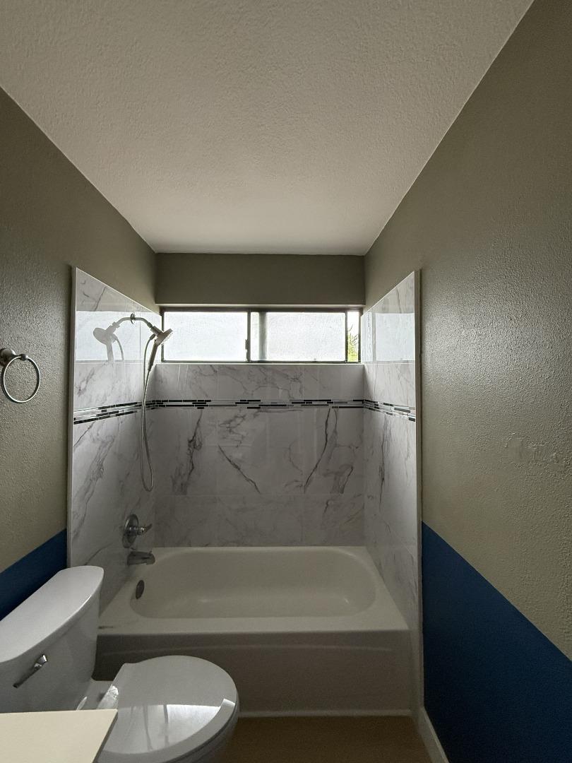 1870 Azurite Way Sacramento, CA 95833 - Photo 29 of 38 a bathroom with a granite countertop bathtub shower sink vanity and toilet