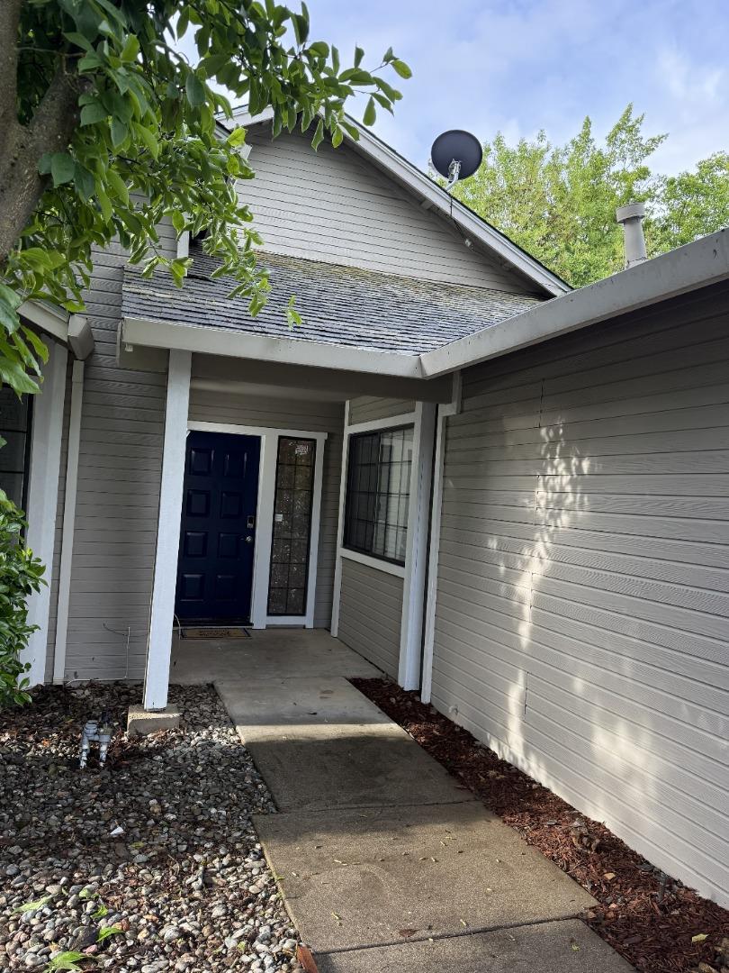 1870 Azurite Way Sacramento, CA 95833 - Photo 3 of 38 a front view of a house with garden