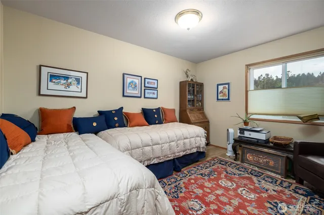 a bed room with two bed and a couch